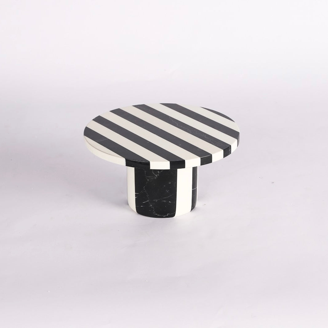 striped white and black medium sized marble cake stand 